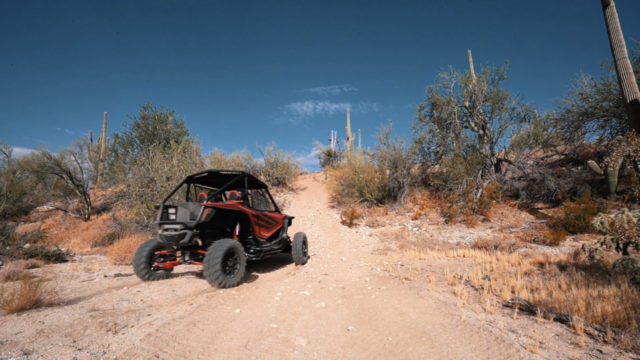 The Honda Talon 1000R heads up a rocky hill
